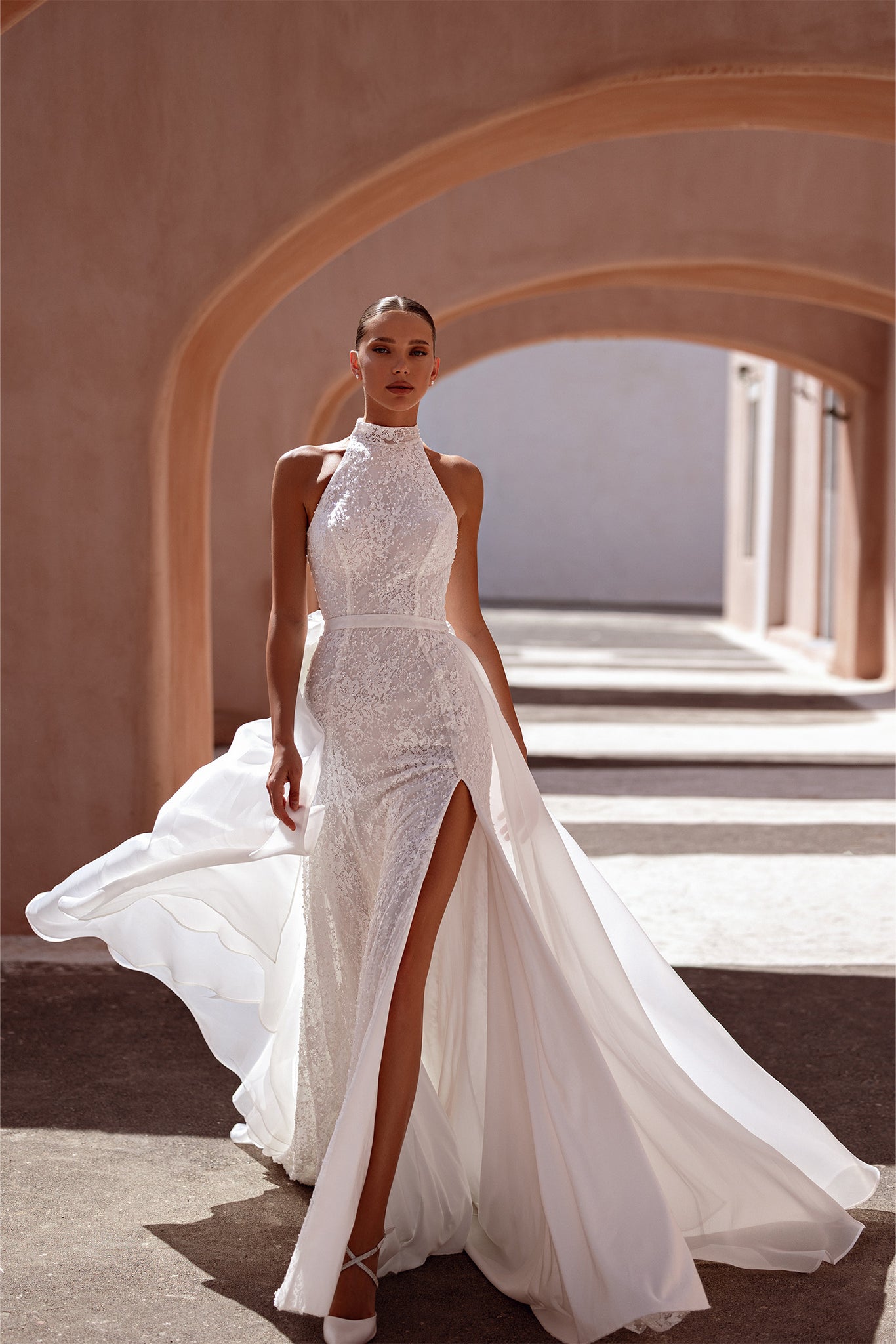 Halter-Style Bridal Gown with Lace Detail and Detachable Overskirt Marelli Exclusive Halter-Style Bridal Gown with Lace Detail and Detachable Overskirt Marelli Exclusive