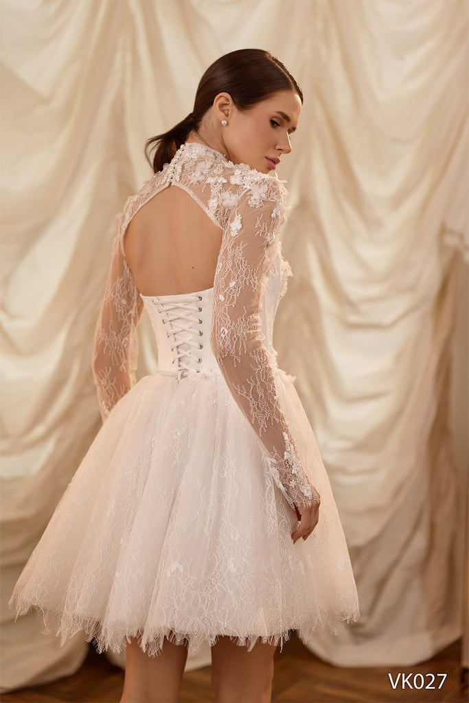 Bridal mini dress with floral appliqués, illusion high-neck lace sleeves, corset bodice, voluminous skirt, and lace-up back