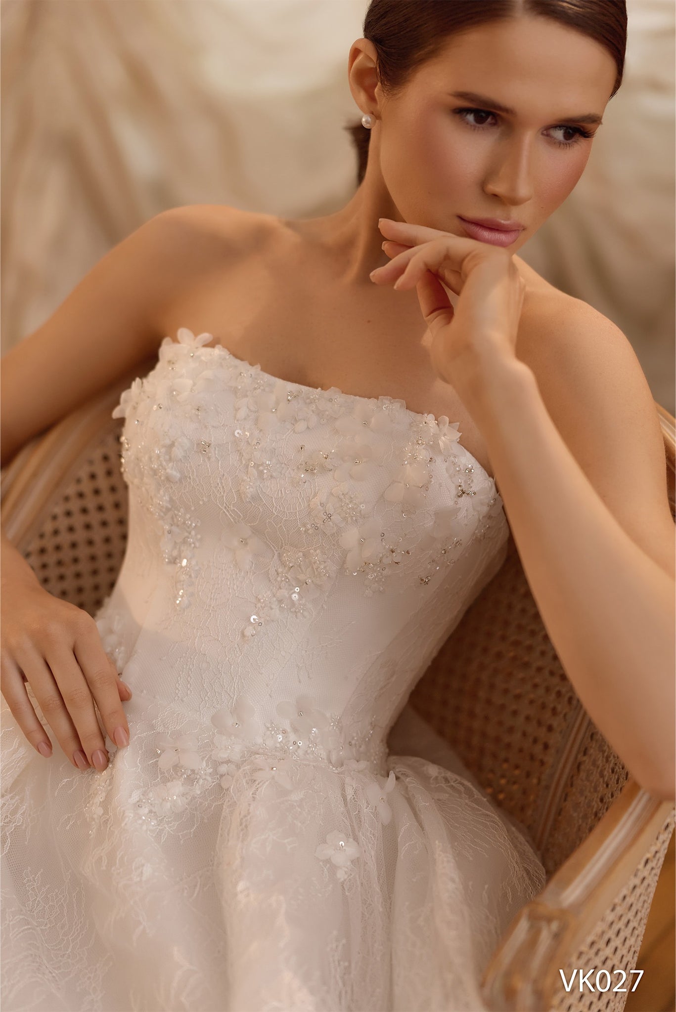 Bridal mini dress with floral appliqués, illusion high-neck lace sleeves, corset bodice, voluminous skirt, and lace-up back