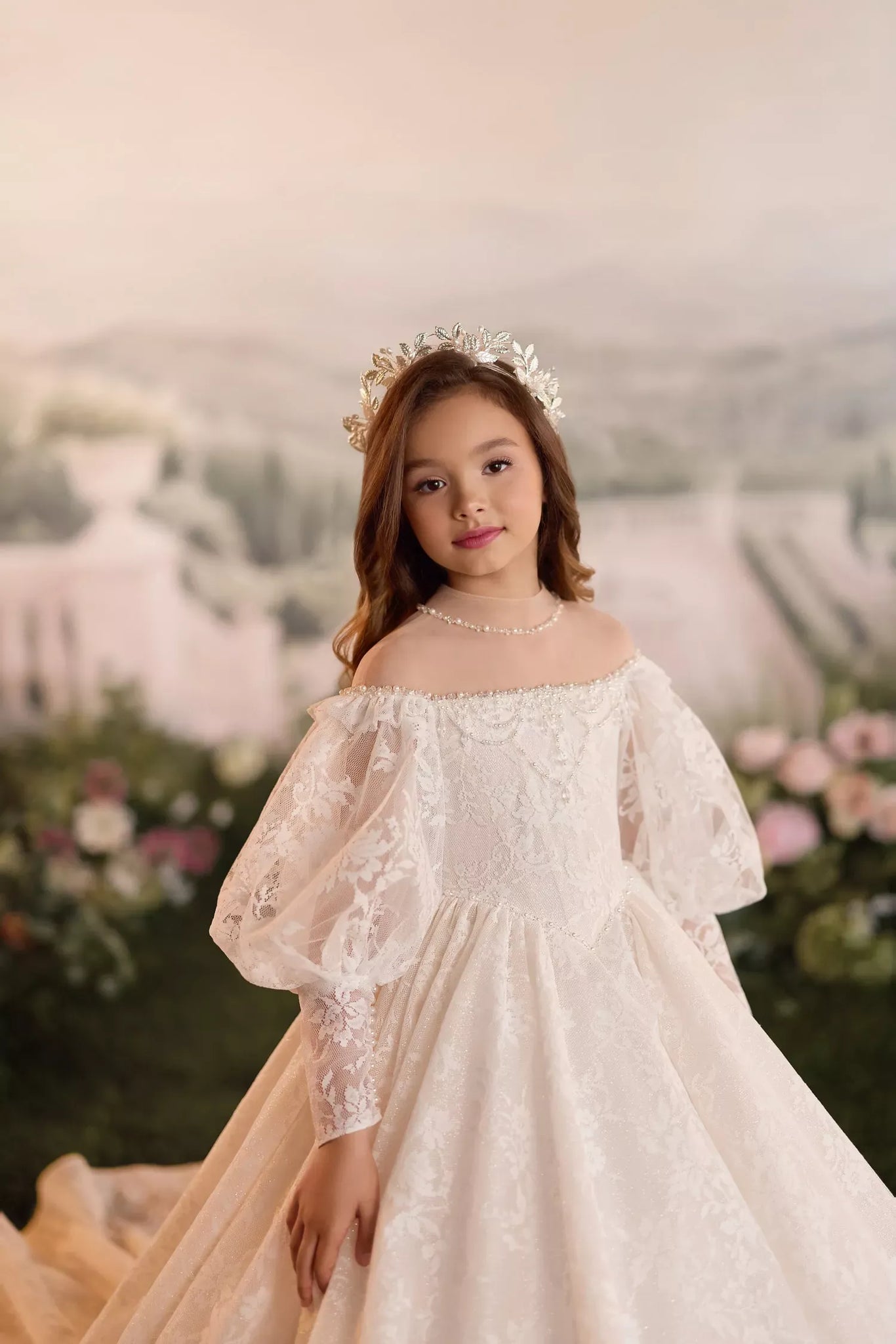 Girl wearing a white lace off shoulder dress and a floral crown