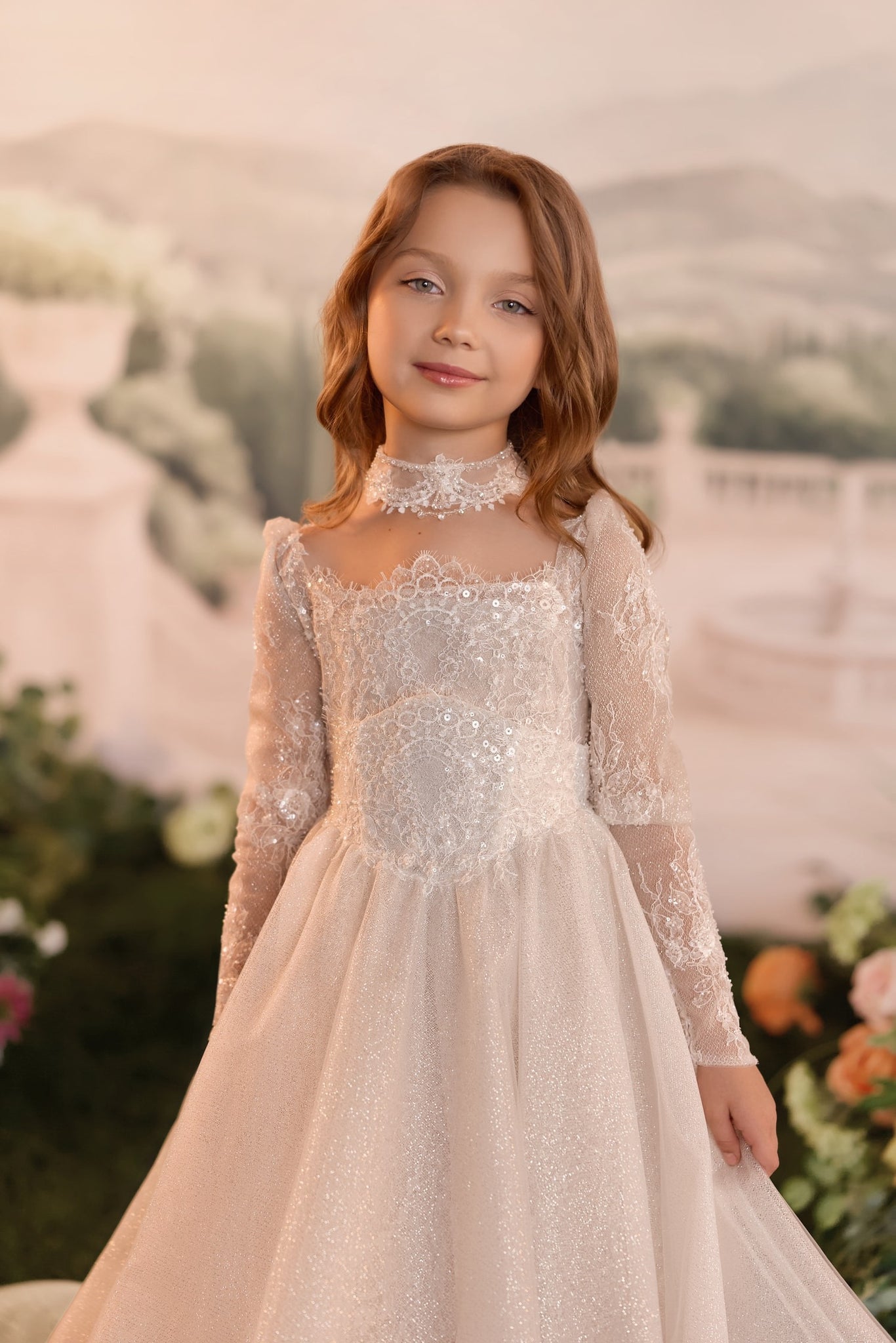 Girl wearing a long sleeve light cappuccino lace dress with a matching choker | Girls Formal Dress