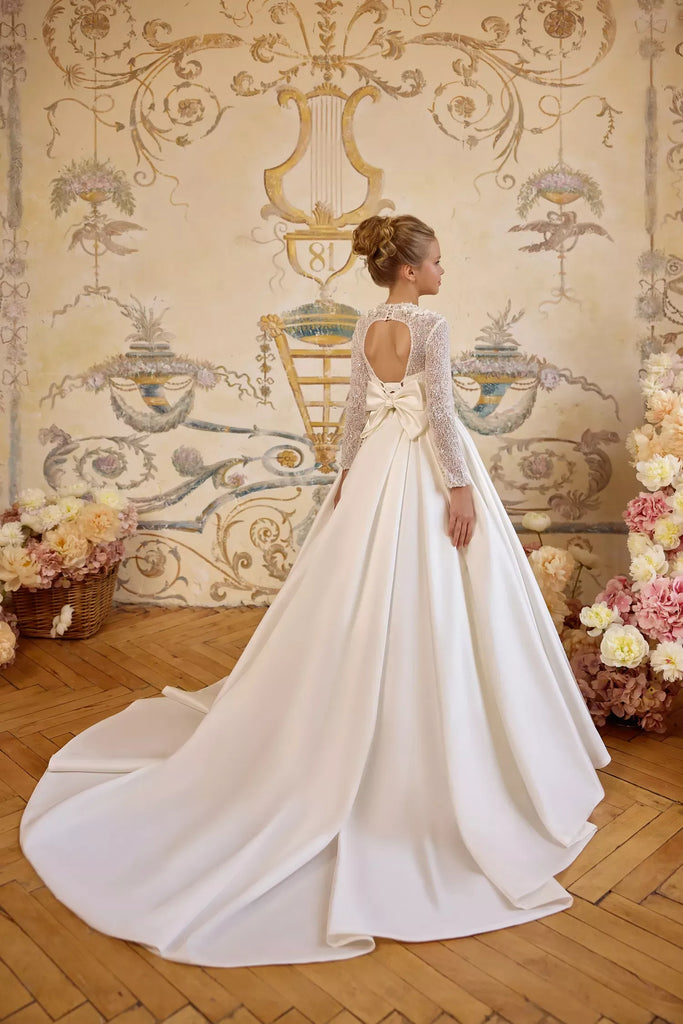 Pentelei 3840 beaded gown with lace sleeves and bow back | Girls Formal Dress