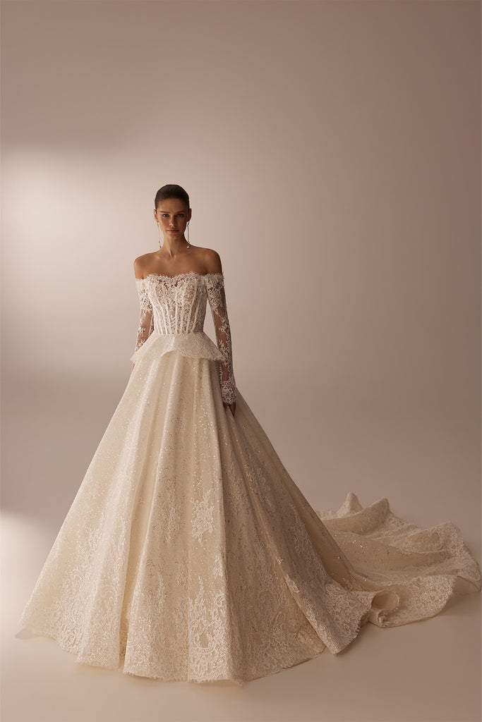Off the shoulder lace wedding dress with long sleeves and a full skirt with a train