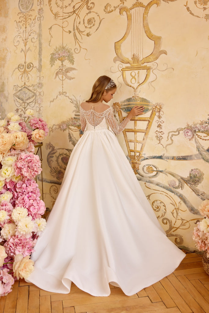 Pentelei 3823 regal beaded gown with sheer sleeves | Girls Formal Dress