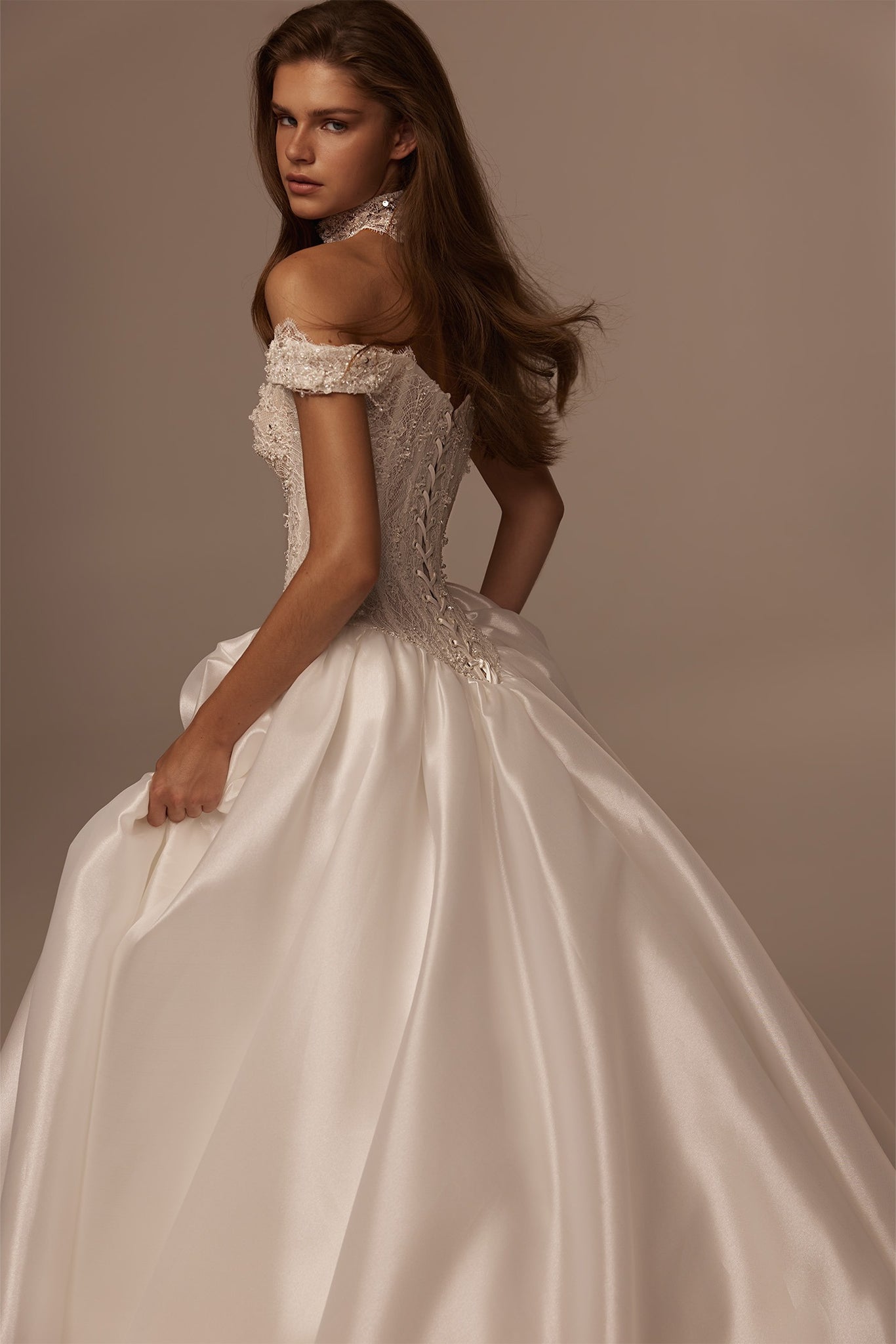 Off the shoulder white ballgown wedding dress with lace bodice and corset back