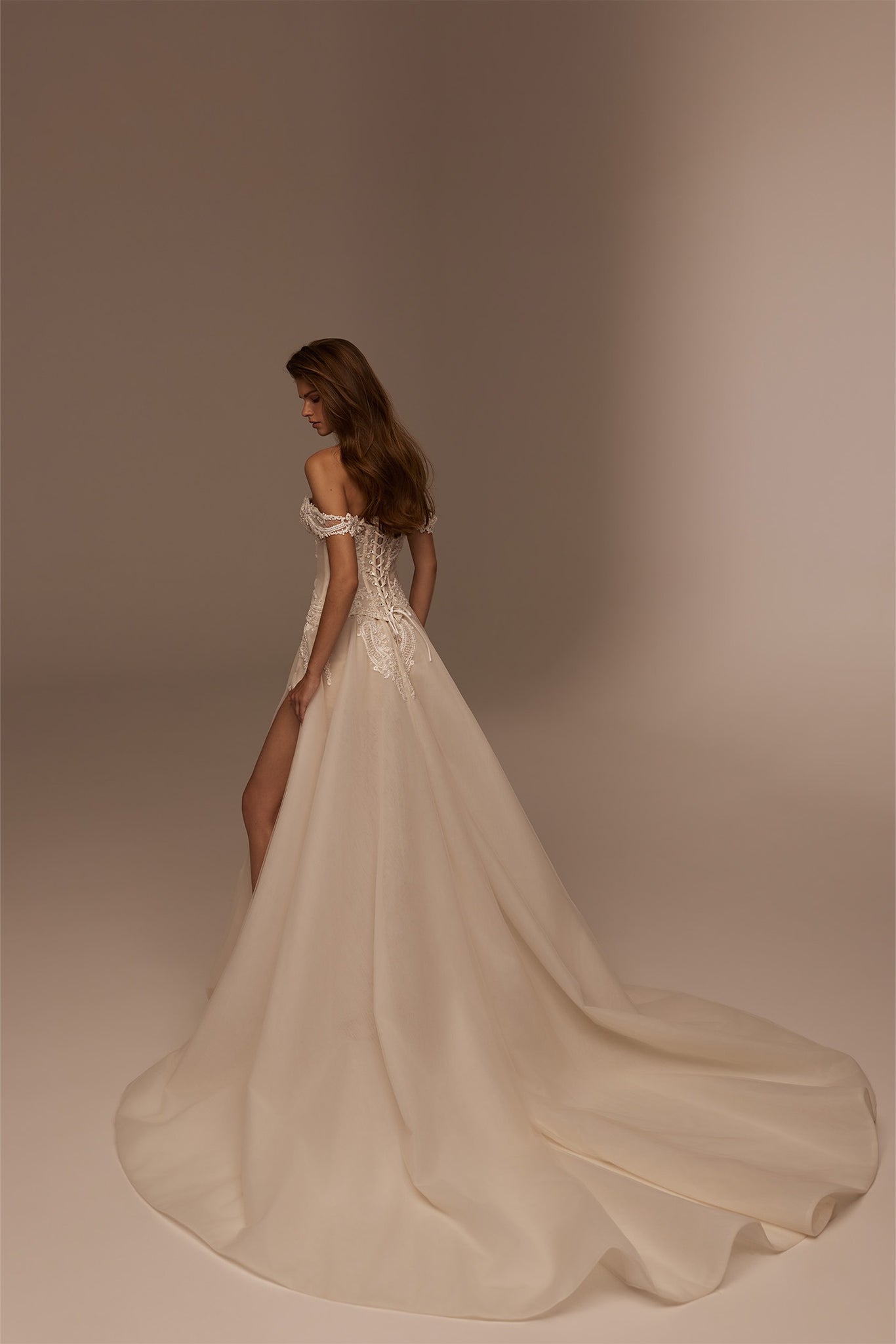 Off the shoulder wedding dress with lace bodice and high leg slit