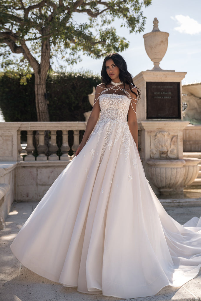 EMABRIDE 260 A-line wedding dress with textured strapless bodice, draped neck detail, appliqué accents, and full skirt