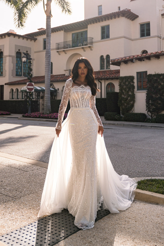 EMABRIDE 276 fitted wedding dress with square illusion neckline, long sleeves, sparkle skirt, and detachable overskirt