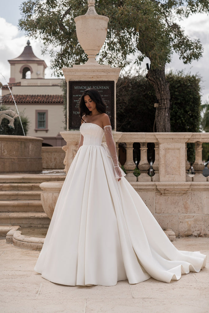 EMABRIDE 258 wedding dress with straight strapless neckline, decorated bodice, big bow in the back, lace up back,  detachable sheer sleeves, and full ball gown skirt