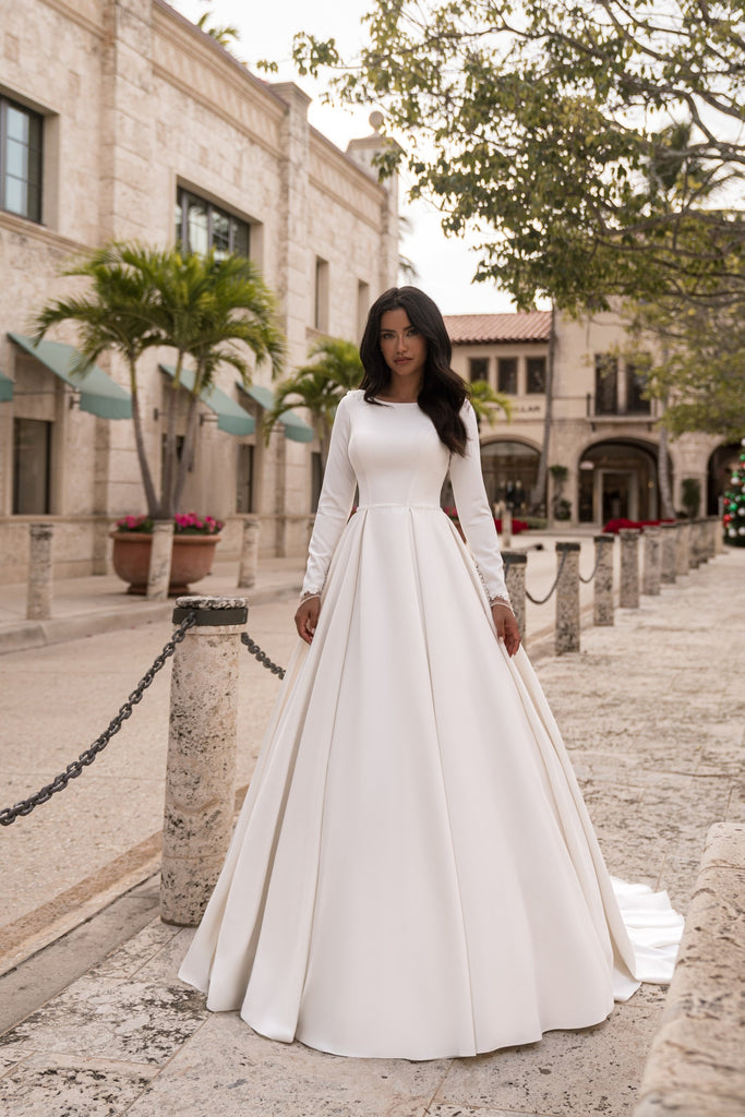 EMABRIDE 279 minimalist wedding dress with high neckline, long sleeves, clean bodice, and full ball gown skirt