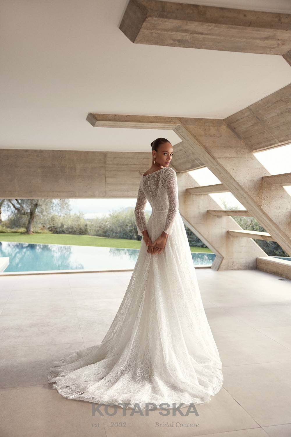 Airy A-line wedding dress with a lace corset bodice, delicate straps, flowing chiffon skirt, lace inserts, and detachable long sleeve lace topper