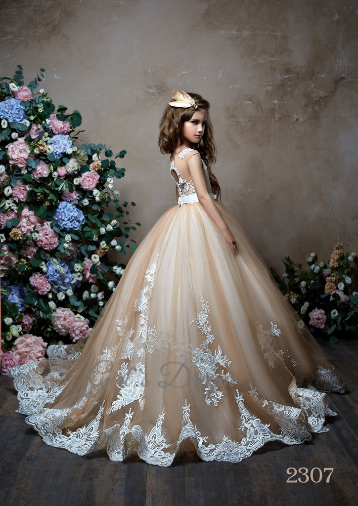 Pentelei 2307 this dress features lace appliques on the skirt and bodice, accentuated by a satin belt with a bow tie at the waist  | Girls Formal Dress